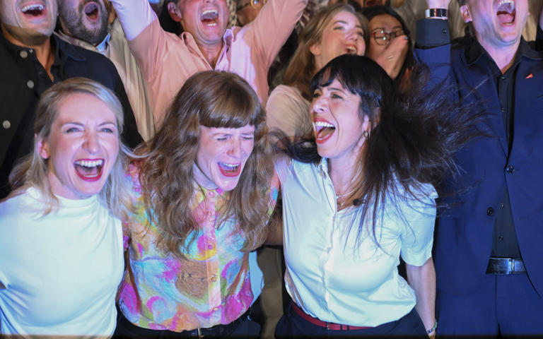 Elif Eralp (second from right) celebrates with party supporters in Berlin on Sunday night