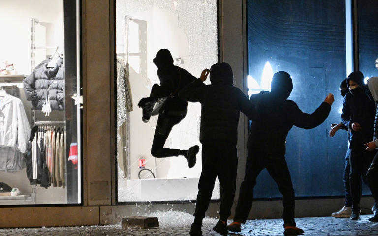 Nearly 130 people have been taken into custody in Paris between Sunday night and Monday