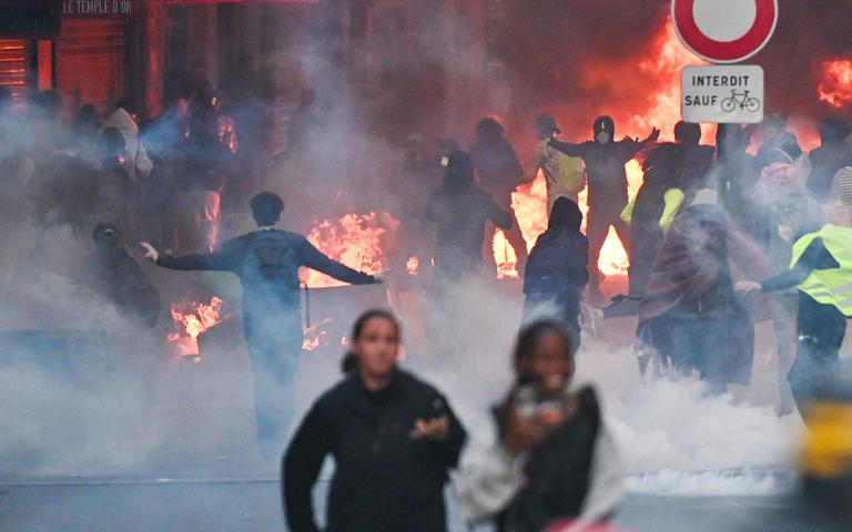 Protesters set fire to Faubourg du Temple street in central Paris on Sunday evening