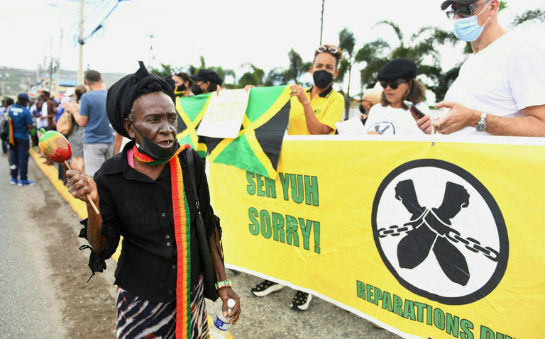 A protest outside the entrance of the British High Commission in Kingston, Jamaica, in 2022 during the visit of the Duke and Duchess of Cambridge 